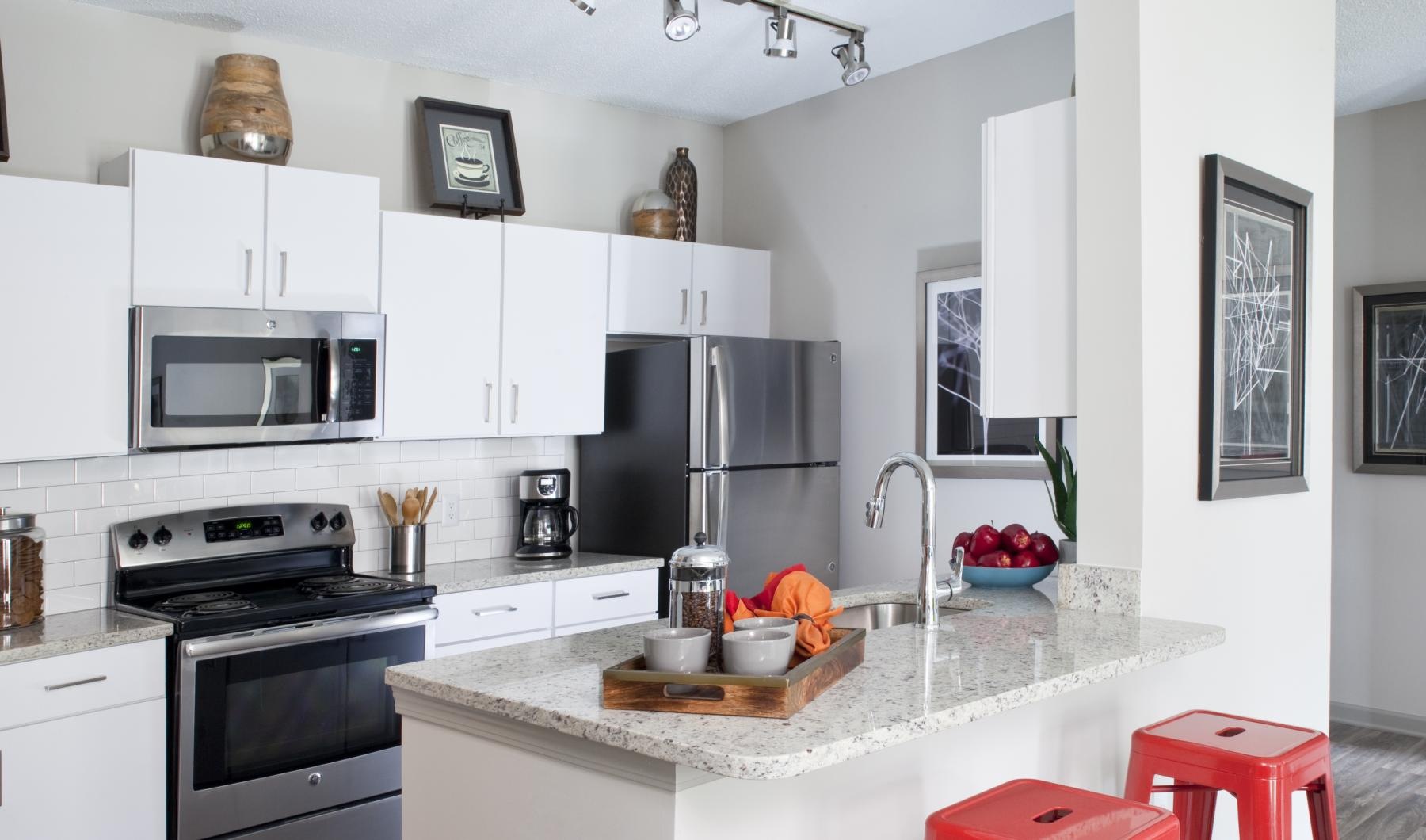 a kitchen with white cabinets